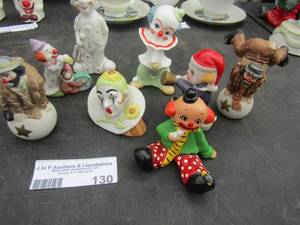 lot 130 image: large lot of ceramic clowns, clown on his head, clown playing the trumpet, and much more