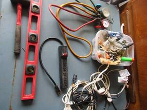 lot 145 image: Freon gauge in good condition, various extension cords, small sledge hammer, level and more