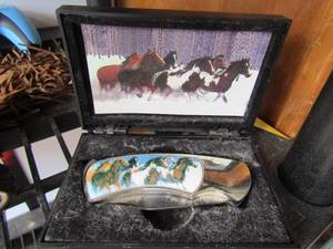 lot 159 image: 440 stainless pocket knife with horse dcor on sides new in case