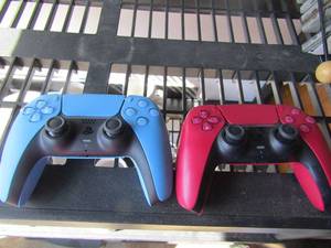 lot 167 image: Red and blue ps5 controllers out of original box both are bran new