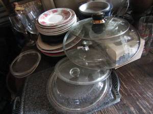 lot 193 image: Large lot of kitchen items, plates of all sizes, glass pan lids only, Wine glasses and cake pans