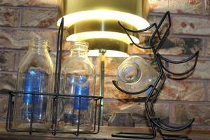lot 96 image: Three Vintage Milk Bottles with a 2 Bottle Carrier and 4 Bottle Wine Rack