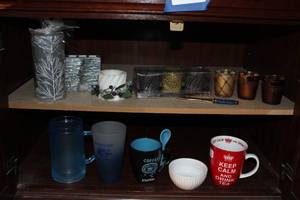lot 104 image: Home Decor Candles and Holders as well as Tea and Coffee Items.. Both shelves, contents only
