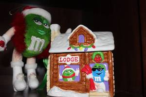 lot 106 image: Winter Themed M&M Cookie Jar and green M&M plush