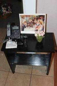 lot 182 image: Small Black Phone Table and contents shown