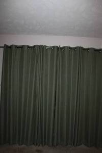 lot 281 image: Dark Green Black Out Curtains and Curtain Rod 4 Panels Each Approximatley