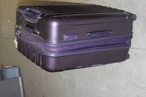 lot 338 image: Hard case purple suitcase