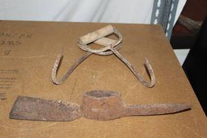 lot 63 image: Vintage Farm Tools T Hooks or Hay bail Hooks and Pick Axe Head without handle