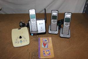 lot 65 image: Three Phone Cordless phone System with Docking Stations and Digital Answering machine