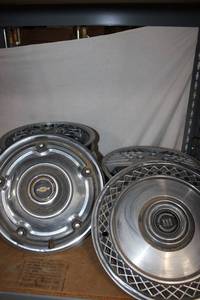 lot 75 image: Variety of Vintage Hubcaps, Set of 4 Pontiac, Chevy, Ford, Olds, and more.. See Photos