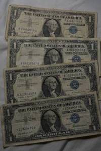 lot 216 image: (4) Silver Certificate One Dollar Bills from Series 1957