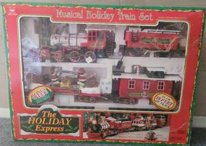 lot 15 image: THE HOLIDAY EXPRESS MUSICAL HOLIDAY TRAIN SET IN BOX AS SHOWN.
