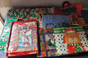 lot 97 image: LOT OF CHRISTMAS GIFT BAGS AS SHOWN.