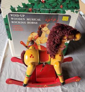 lot 165 image: WIND-UP WOODEN MUSICAL ROCKING HORSE IN BOX AS SHOWN.