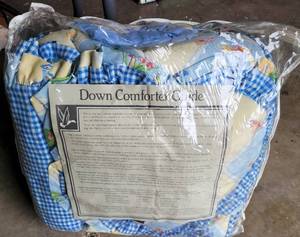 lot 180 image: DOWN COMFORTER IN STYLEDESIGN SHOWN.