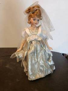 lot 35 image: Porcelain Doll with stand