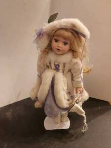 lot 116 image: Porcelain Doll with stand