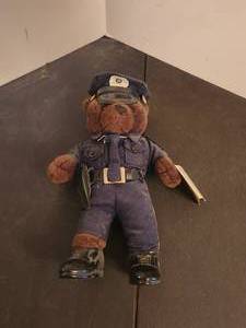 lot 168 image: Policeman Teddy Bear