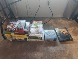 lot 301 image: Generous selection of puzzles, some unopened