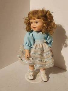 lot 326 image: Porcelain Doll with stand