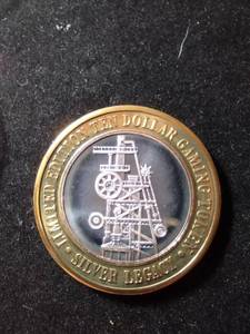 lot 1 image: Limited Edition Ten Dollar Gaming Token - Silver Legacy. .999 Fine Silver, 2nd Anniversary 1997 Coin