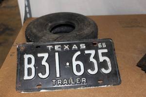 lot 14 image: 1966 Texas Trailer Black License plate and Carlisle Tubeless 11x4.00-4nhs Lawnmower Tire