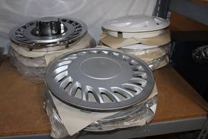 lot 28 image: Two Sets of 4 Hubcaps and one set of 3 Hubcaps, style and color shown in photos