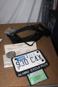 lot 102 image: Front Hanger Repair Kit and 07 Motorcycle License Plater
