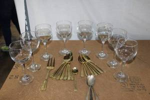 lot 160 image: Eight Clear Wine Glasses and 17 Pieces of Gold Tone or Brass Flatware, also 3 Silverplated Spoons