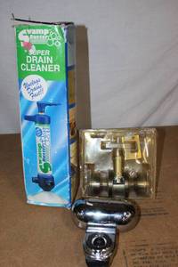 lot 165 image: Swamp Buster Drain Cleaner, Pure water Faucet Attachment, and Non locking Door knob