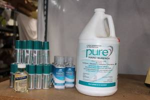 lot 168 image: Pure Commercial Hard Surface Cleaner, Hand Sanitizer and small bottles of Hand Lotion