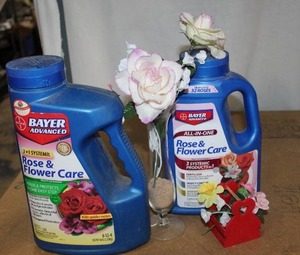 lot 177 image: Rose and flower care Plant Food( Each bottle is 12 to 34 full)