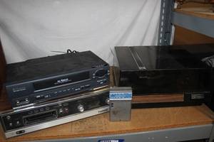 lot 180 image: Vintage Realistic Turntable, Panasonic 8 Track Player, and an Emerson 4-head VHS Player AND a GE portable Walkman style radio
