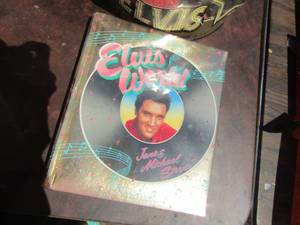 lot 17 image: Elvis presley Doll figurine, Book about Elvis Presley