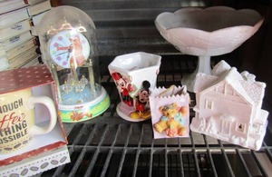 lot 27 image: Milk glass long stem stand fruit design bowl, Scooby doo clock with glass cover, Mickey mouse dish, white ceramic house needs painted