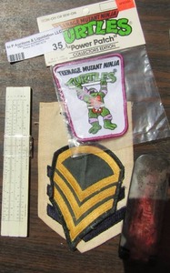 lot 35 image: Ninja turtles power patch new, Sterling slide ruler, various Carolina panther football cards