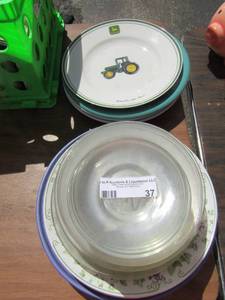 lot 37 image: Large lot of saucers and dinner plates, some clear glass others are colored plain