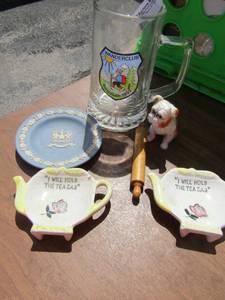 lot 39 image: Wanderclub beer mug ,WEDGEWOOD TRINKET PLATE, mini dog figurine, mini rolling pen, 2 tea pot mini saucers that says I will hold the tea bag