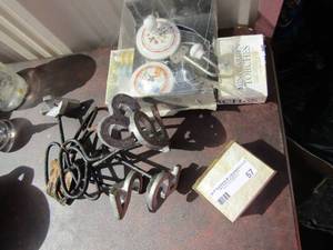 lot 57 image: Number brands 2 thru 7, wall hooks new qty 2,  Mini garden torches nib qty 4