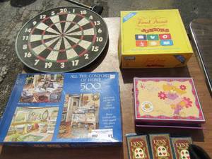lot 61 image: Game lot includes, dart board, trivial pursuit, 500 piece puzzle, playing cards