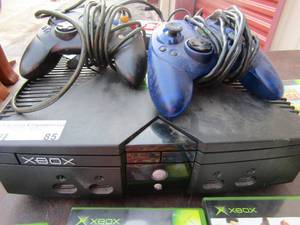 lot 85 image: X Box gaming system with all plugs and cords also comes with 2 game controllers used condition