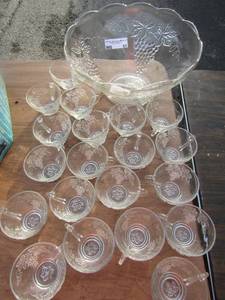 lot 91 image: Large clear glass grape design fruit punch bowl, comes with 20 handled punch glasses with same design like new