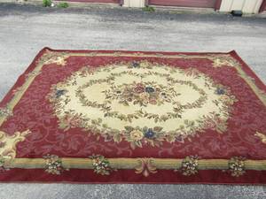 lot 7 image: Burgandy and Off White area rug very large needs a little cleaning from sitting, in great condition  10 12 X 7 12 Ft  BY GRAND LEGACY