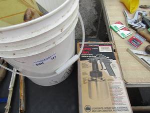 lot 107 image: Sears craftsman spray rig NIB, various paint brushes and scrappers in a white bucket