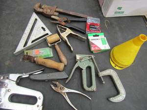 lot 110 image: Tool lot includes, wrench, scrapper, staple gun hand held, plyers, screws and more