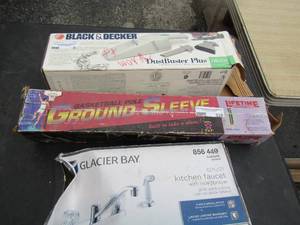lot 111 image: Glacier bay kitchen faucet NIB, Basketball pole sleeve NIB, Black and decker dust buster vacuum NIB