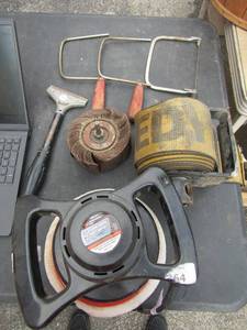 lot 125 image: 3 hand saw saw need blades, 1 scraper, 1 largesanding wheel, heavy duty 18 wheel tie down strap, 10  polisher buffer