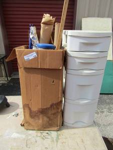lot 128 image: 5 drawer rolling storage caddy, used rolls of wall paper, yard stick, and more