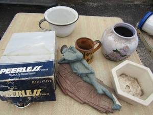 lot 141 image: Peerless nib faucet, planter pots, and a welcome yard dcor sign