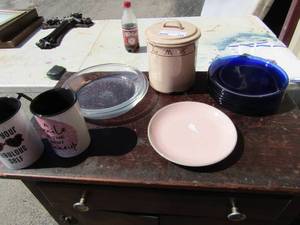 lot 149 image: kitchen lot includes, set of 3 canisters with lids, 8 blue glass saucers, 2 Pyrex pie plates, and 2 mugs